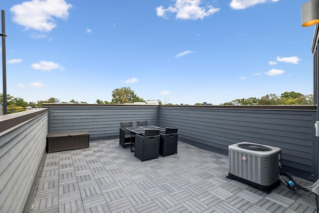 view of patio featuring central AC and outdoor dining space
