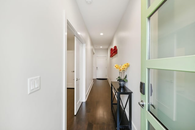 corridor featuring recessed lighting, baseboards, and dark wood-style floors