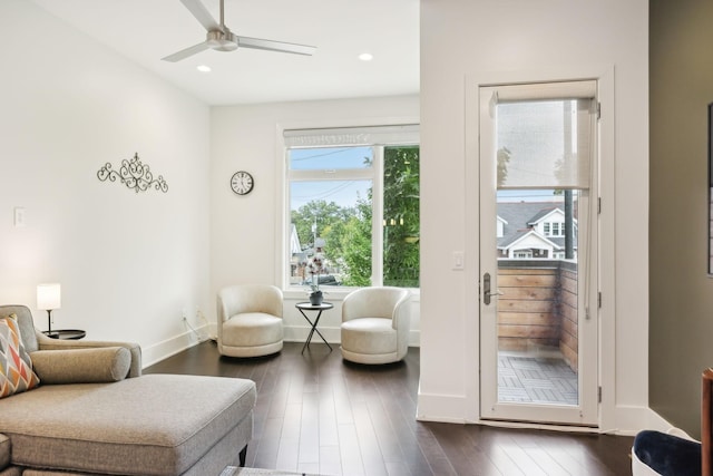 interior space featuring a ceiling fan, baseboards, recessed lighting, and dark wood-type flooring