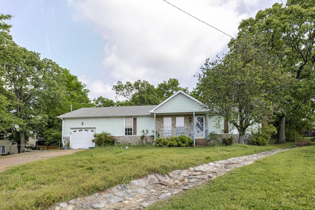 single story home featuring a garage, a front lawn, covered porch, stone siding, and driveway