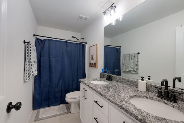 bathroom featuring toilet, tile patterned floors, visible vents, and a sink