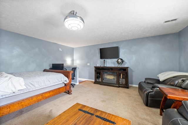 2764 Ann Dr, Clarksville, TN 37040 - carpeted bedroom featuring baseboards, a textured ceiling, and visible vents