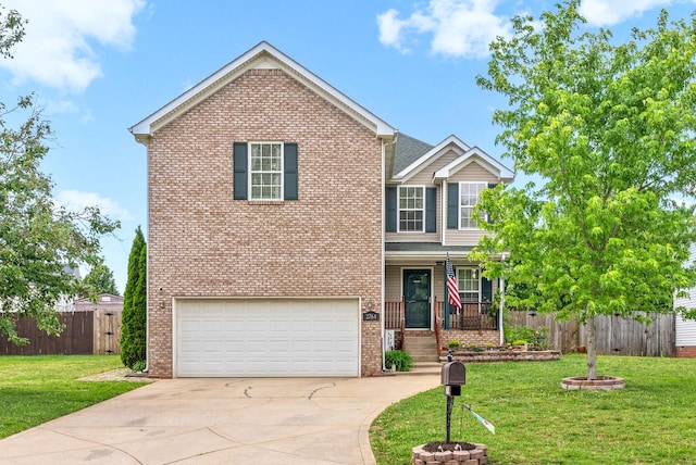 2764 Ann Dr, Clarksville, TN 37040 - view of front of home featuring a garage, fence, brick siding, a porch, and driveway