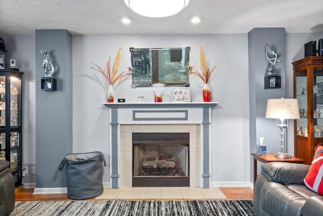 2764 Ann Dr, Clarksville, TN 37040 - living room featuring recessed lighting, baseboards, wood finished floors, and a fireplace