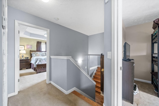 2764 Ann Dr, Clarksville, TN 37040 - staircase featuring a textured ceiling, baseboards, and carpet