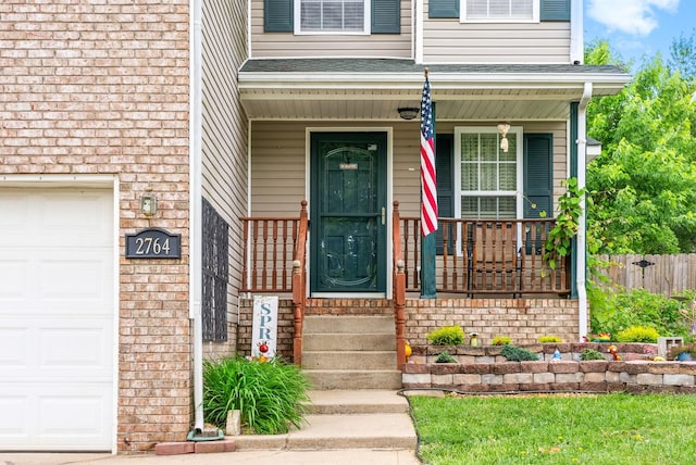 2764 Ann Dr, Clarksville, TN 37040 - doorway to property with fence, a porch, and brick siding