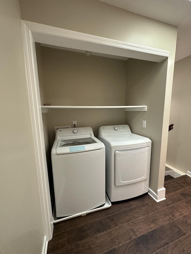 laundry room with independent washer and dryer, laundry area, dark wood-style floors, and baseboards