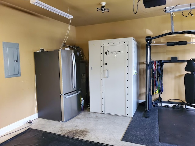 201 Birdie Ct, Dickson, TN 37055 - garage with freestanding refrigerator, baseboards, electric panel, and a garage door opener