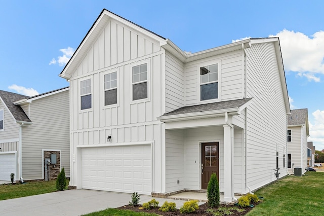 modern farmhouse featuring a garage, board and batten siding, driveway, and roof with shingles