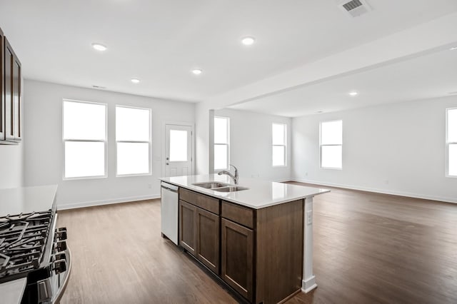 kitchen featuring open floor plan, appliances with stainless steel finishes, visible vents, and a sink