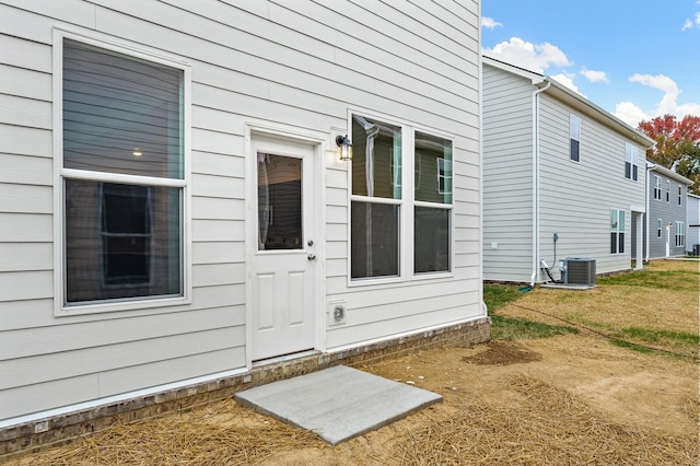 view of exterior entry featuring cooling unit