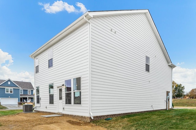 exterior space with a lawn and cooling unit
