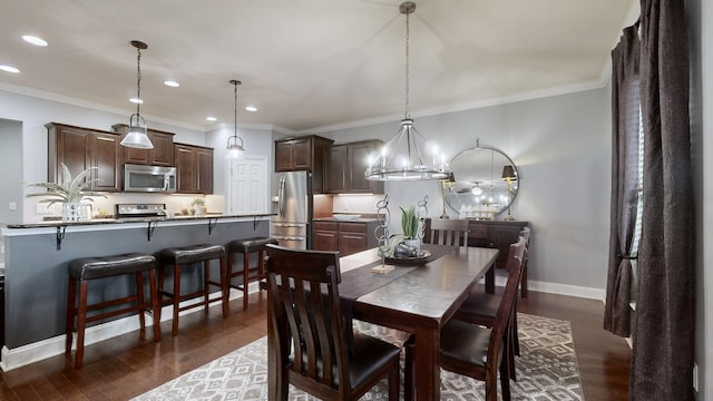 dining room with recessed lighting, crown molding, baseboards, and dark wood-type flooring