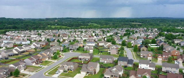 birds eye view of property with a residential view