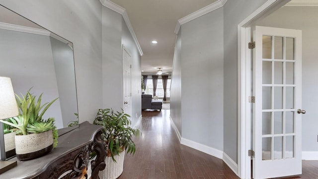 hallway featuring crown molding, wood finished floors, baseboards, and recessed lighting