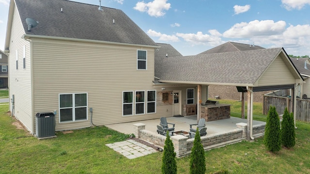 back of property featuring a patio area, exterior kitchen, a yard, and cooling unit
