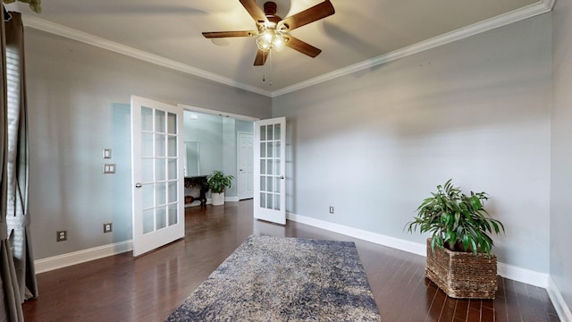 interior space with dark wood-style flooring, french doors, a ceiling fan, baseboards, and ornamental molding