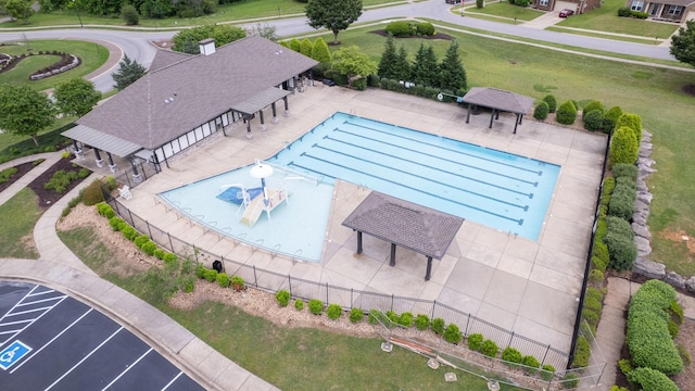 pool featuring a yard, a gazebo, and fence