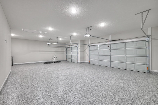 garage featuring baseboards and a garage door opener