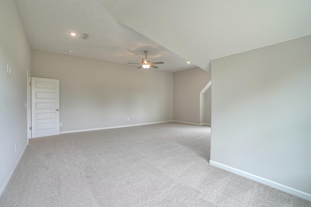 unfurnished room with ceiling fan, light carpet, recessed lighting, baseboards, and visible vents