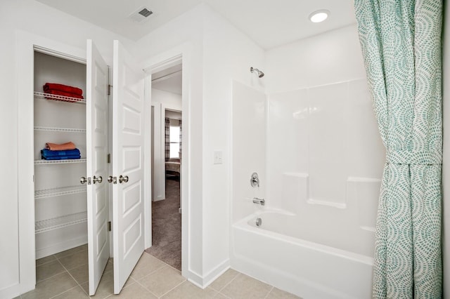 full bath featuring visible vents, shower / bathtub combination with curtain, and tile patterned flooring