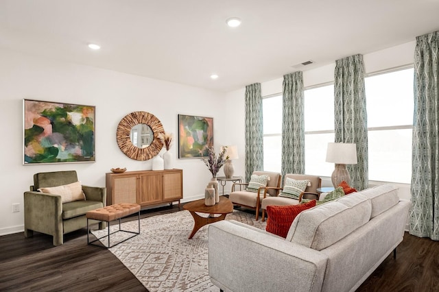 living room featuring baseboards, dark wood-type flooring, recessed lighting, and visible vents