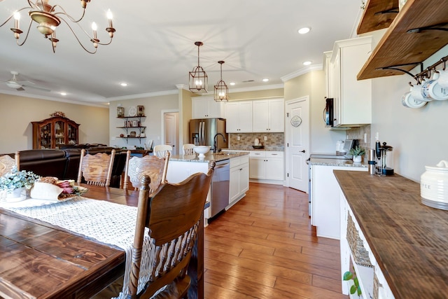 5014 Rainier Dr, Chapel Hill, TN 37034 - dining area with a chandelier, recessed lighting, wood-type flooring, crown molding, and a ceiling fan