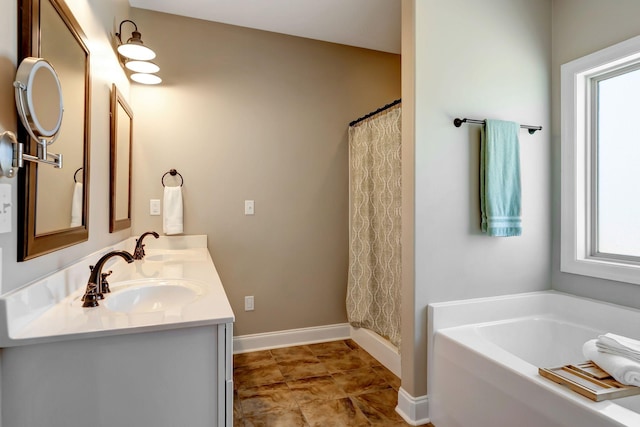 5014 Rainier Dr, Chapel Hill, TN 37034 - bathroom with healthy amount of natural light, baseboards, a garden tub, and double vanity