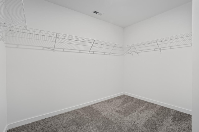 walk in closet with carpet floors and visible vents