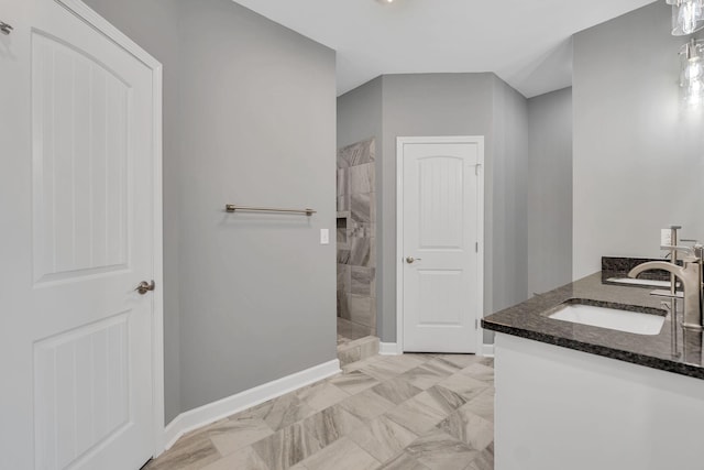 149 Watson Ct, Leoma, TN 38468 - bathroom with double vanity, a sink, a walk in shower, baseboards, and marble finish floor