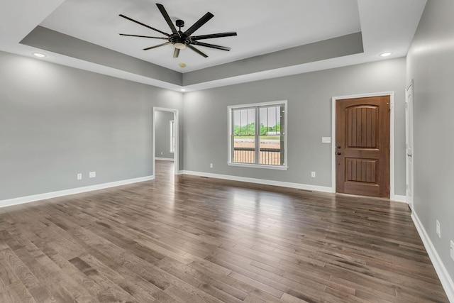 149 Watson Ct, Leoma, TN 38468 - unfurnished room with wood finished floors, baseboards, ceiling fan, recessed lighting, and a tray ceiling