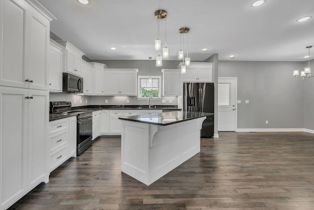 149 Watson Ct, Leoma, TN 38468 - kitchen featuring range with electric stovetop, stainless steel refrigerator with ice dispenser, white cabinetry, and dark countertops