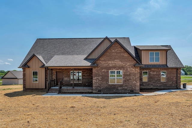 149 Watson Ct, Leoma, TN 38468 - rear view of house featuring board and batten siding, brick siding, and covered porch