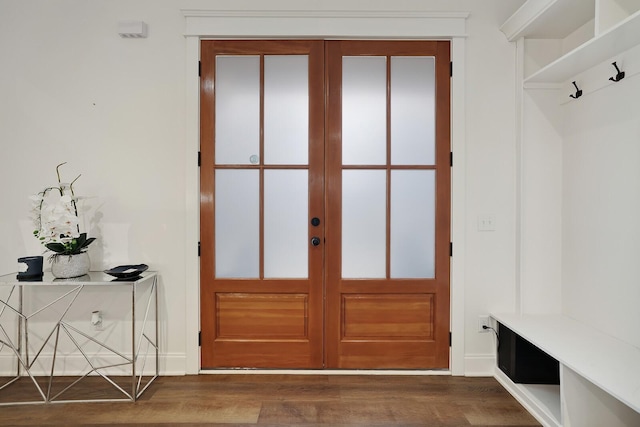 mudroom with baseboards, french doors, and dark wood finished floors