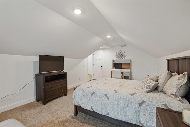 bedroom with baseboards, visible vents, light carpet, and lofted ceiling