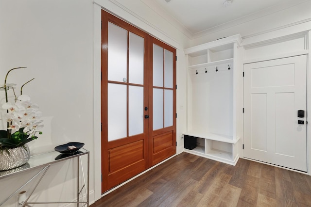 mudroom featuring ornamental molding and wood finished floors