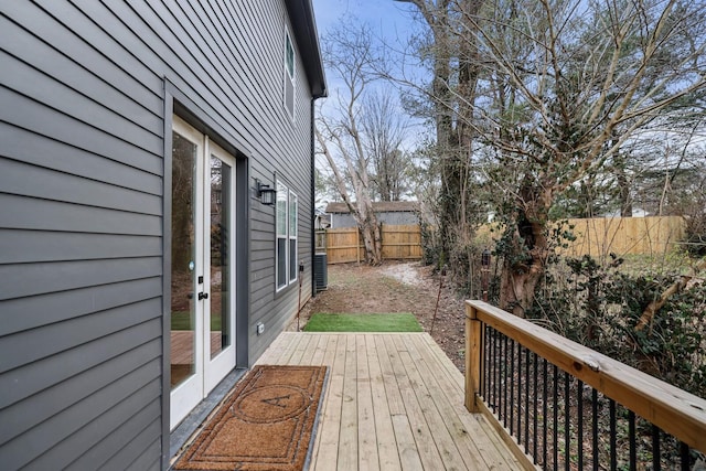 wooden deck featuring a fenced backyard
