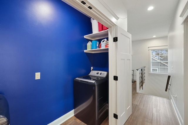clothes washing area with laundry area, recessed lighting, washer / dryer, and wood finished floors