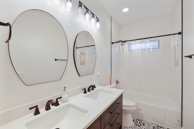 full bath featuring a sink, tile patterned flooring, toilet, and double vanity