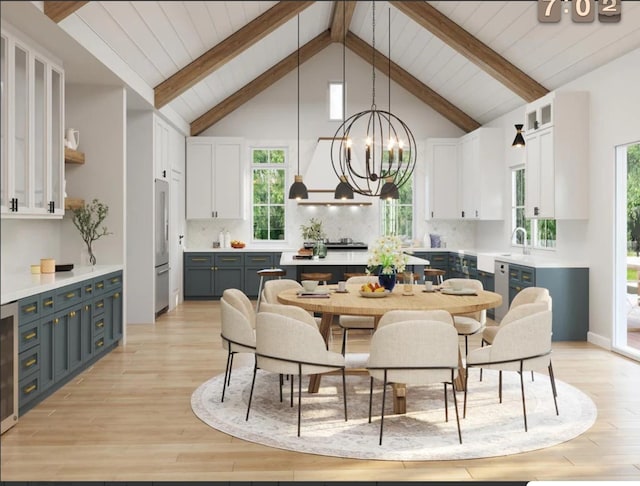 dining room featuring an inviting chandelier, beamed ceiling, light wood-style floors, and a healthy amount of sunlight
