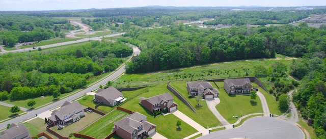 bird's eye view featuring a view of trees and a residential view