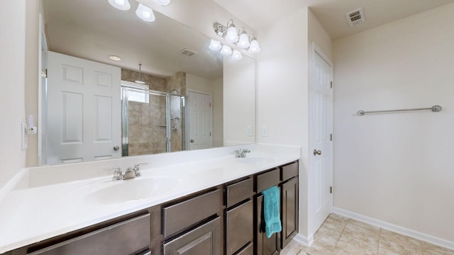 full bath with double vanity, visible vents, a sink, and a stall shower