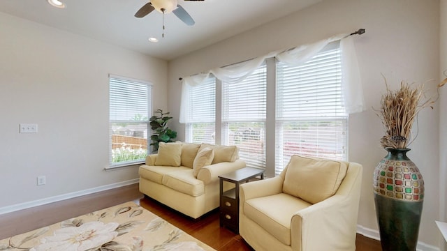 living area featuring dark wood-style flooring, ceiling fan, recessed lighting, and baseboards