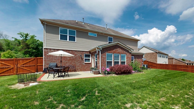 back of property featuring central air condition unit, brick siding, a fenced backyard, a yard, and a patio