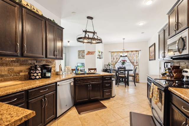 141 Fieldcrest Cir, Hendersonville, TN 37075 - kitchen featuring stainless steel appliances, a sink, backsplash, and dark brown cabinetry