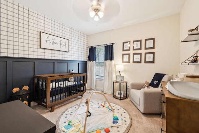 141 Fieldcrest Cir, Hendersonville, TN 37075 - bedroom featuring a crib, a sink, a decorative wall, carpet floors, and a ceiling fan