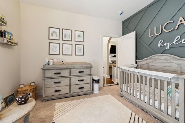 141 Fieldcrest Cir, Hendersonville, TN 37075 - bedroom featuring light carpet, a crib, and arched walkways