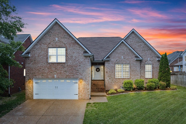 141 Fieldcrest Cir, Hendersonville, TN 37075 - traditional-style home with a garage, concrete driveway, and brick siding
