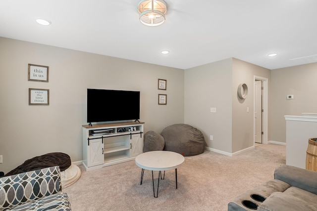 living area featuring light carpet, baseboards, and recessed lighting