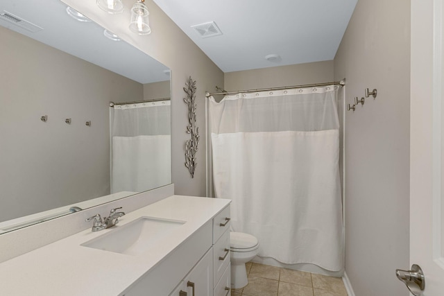 full bathroom featuring tile patterned flooring, toilet, visible vents, and vanity